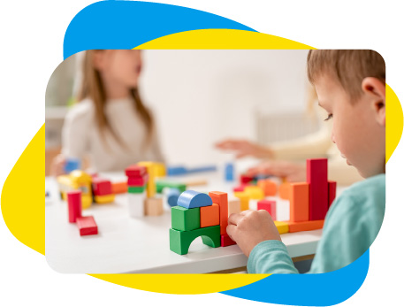 Young boy building with blocks